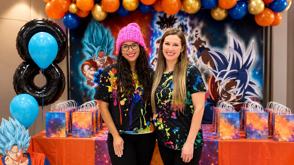 Colory Faces team members at a colorful themed family party setup.